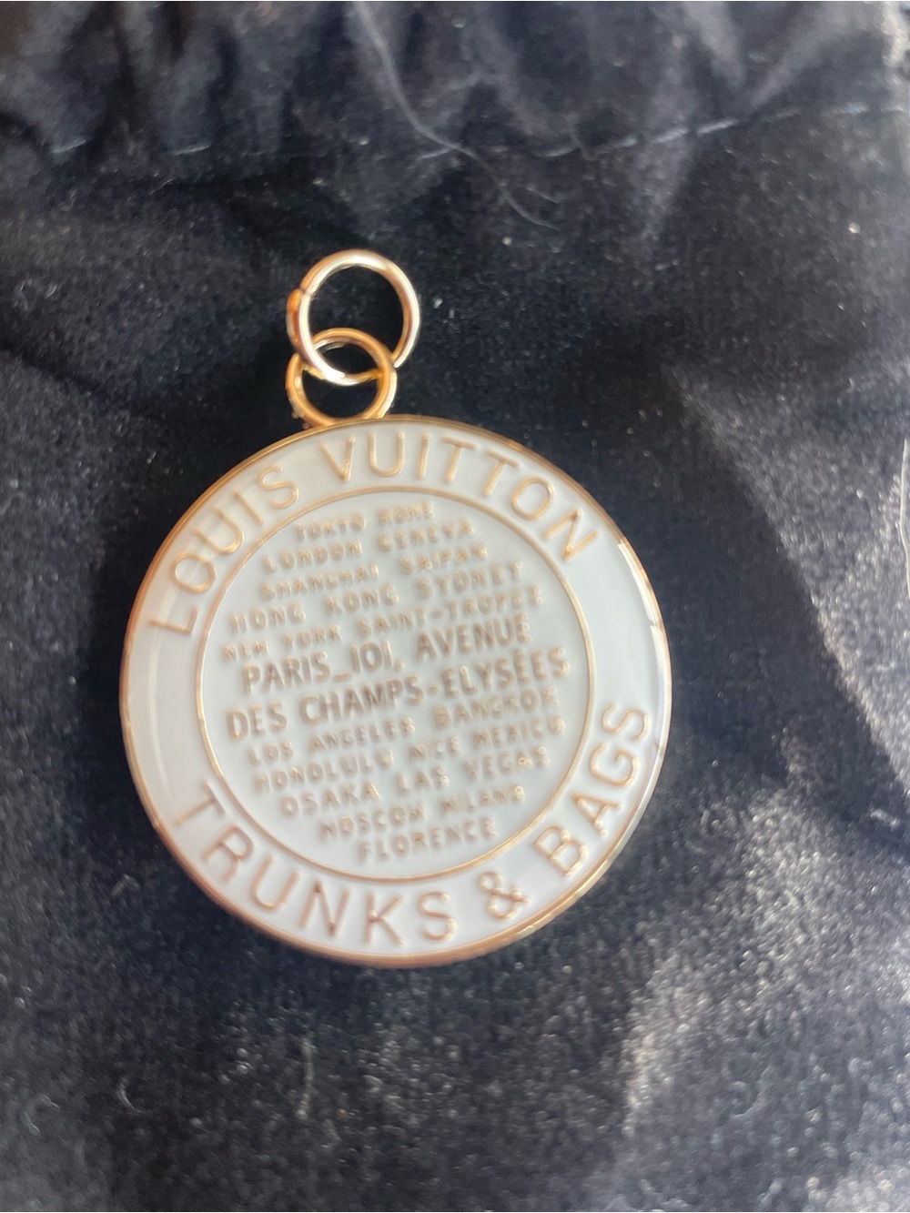 Charm light blue and gold round “trunks and bags” round enamel pendant